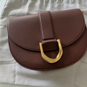Charles & Keith Chestnut Brown Saddle Crossbody with Gold Buckle